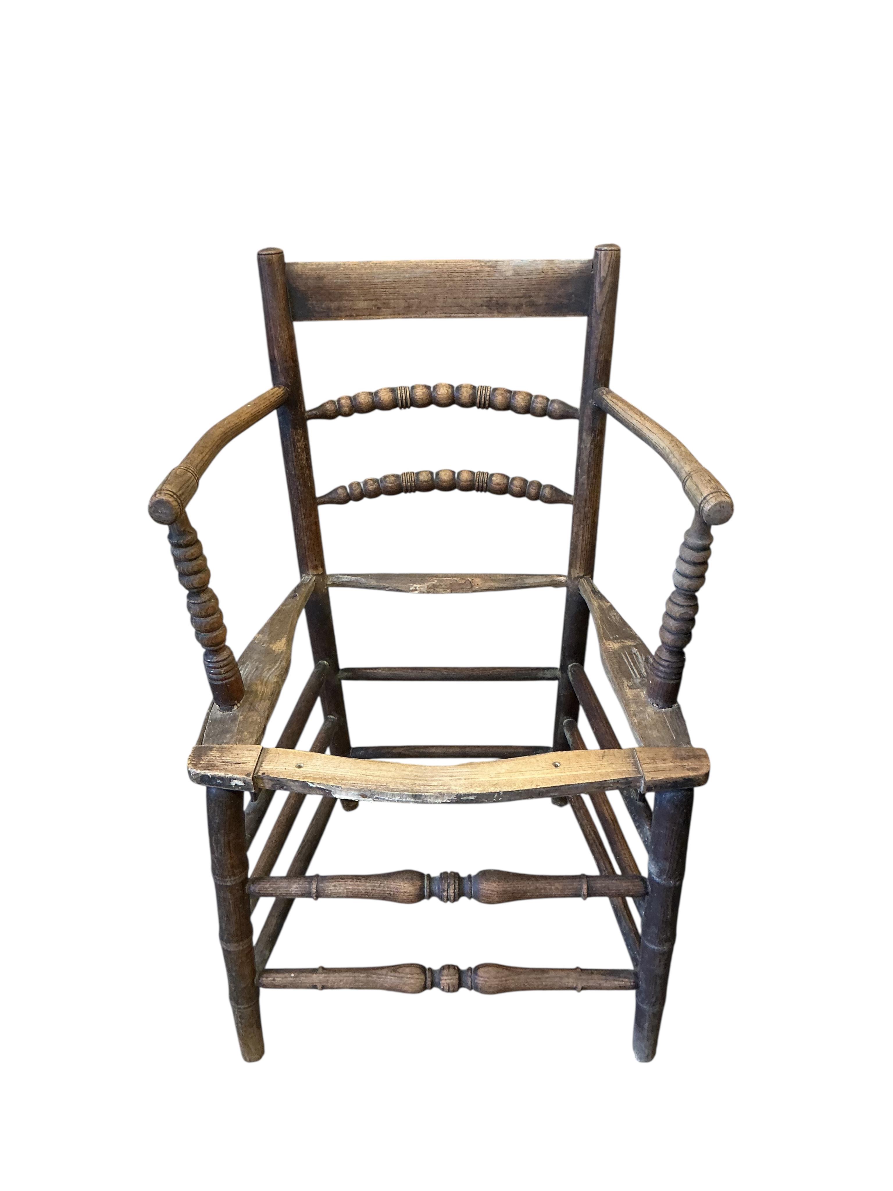 Six 19th century and later Sussex elbow chairs, in need of restoration
